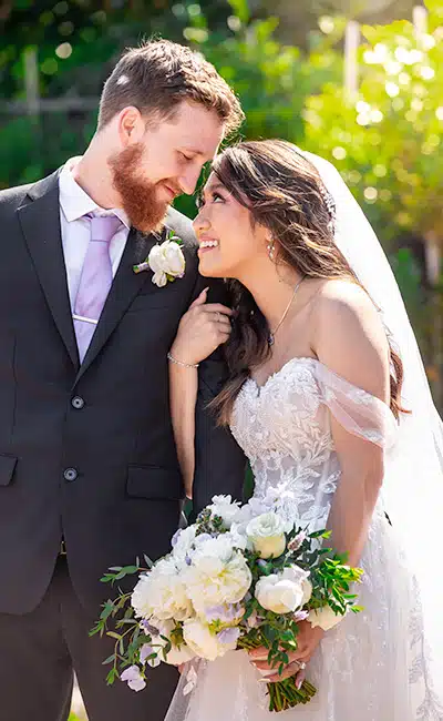 wedding photography: Smiling bride and groom portrait.