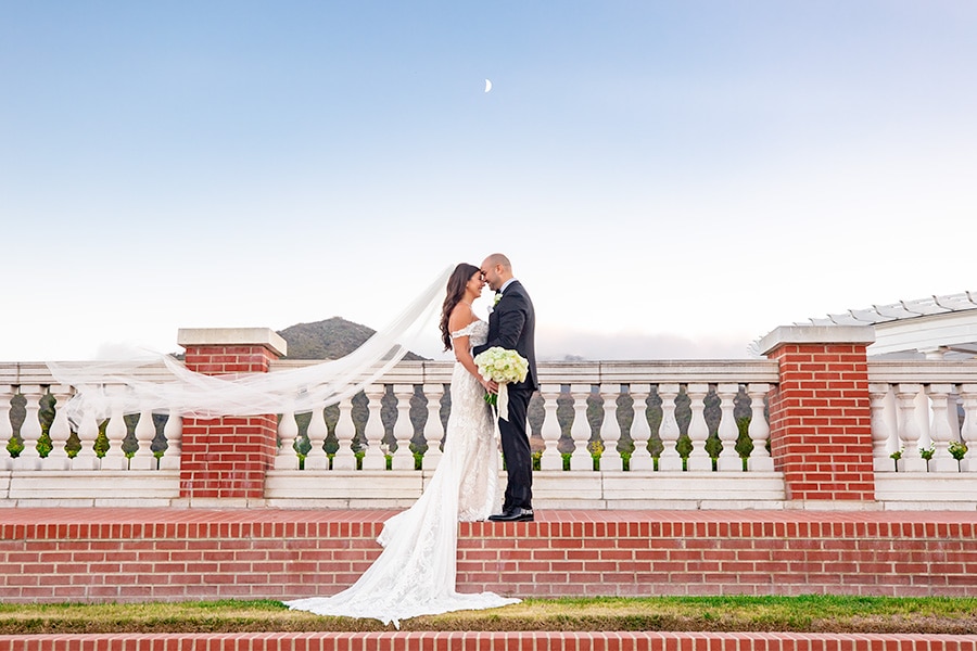Couple at terrace rail.