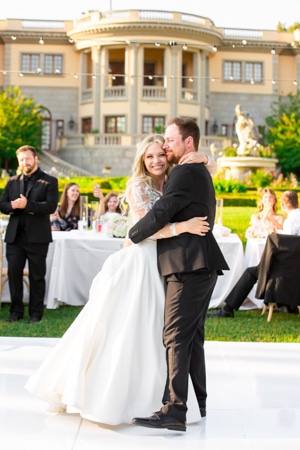 Couple having sweet hug after the wedding ceremony