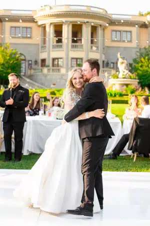 Couple having sweet hug after the wedding ceremony