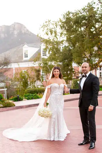 Couple posing with scenic mountain view.