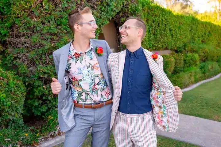 Fun groom portraits in floral shirts.