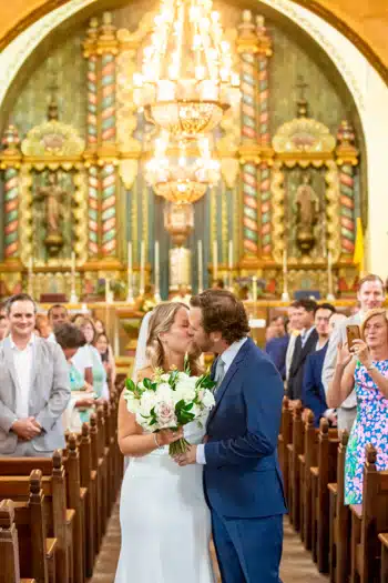 A cute wedding kiss of a couple