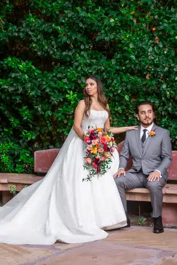 wedding photography: Couple at garden bench.