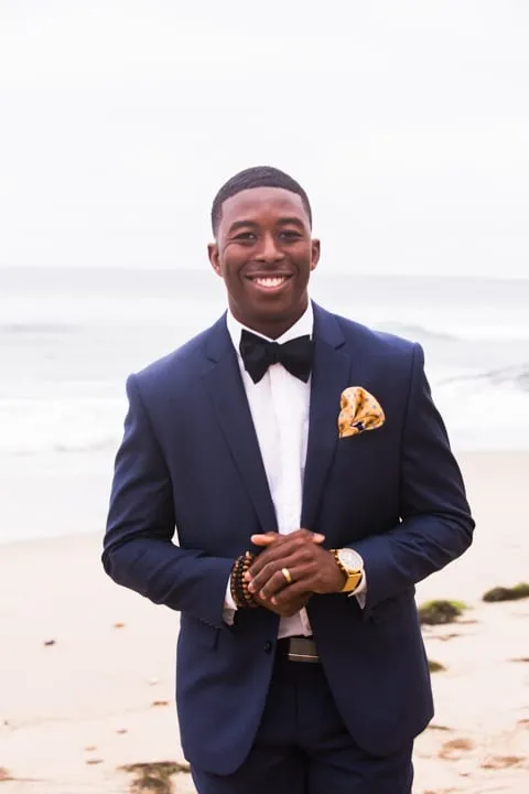 groom standing on beach side