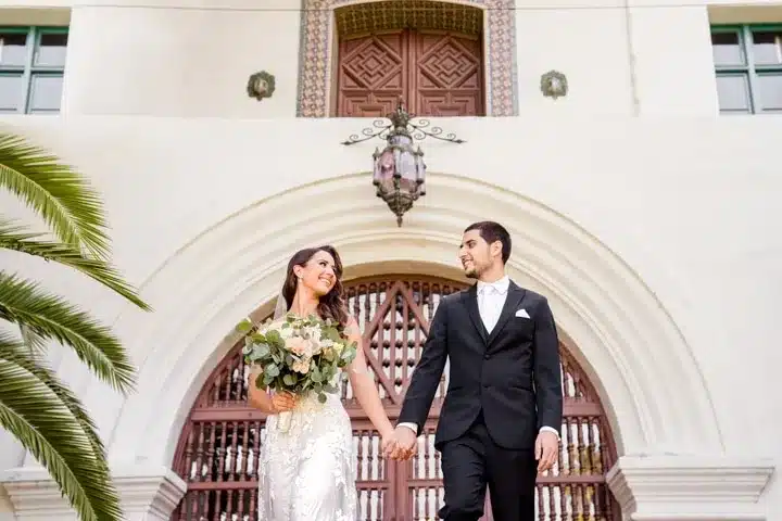 Bride and groom walking hand in hand