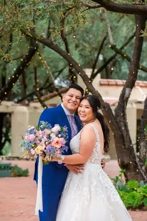 Bride and groom holding wedding bouquet-2