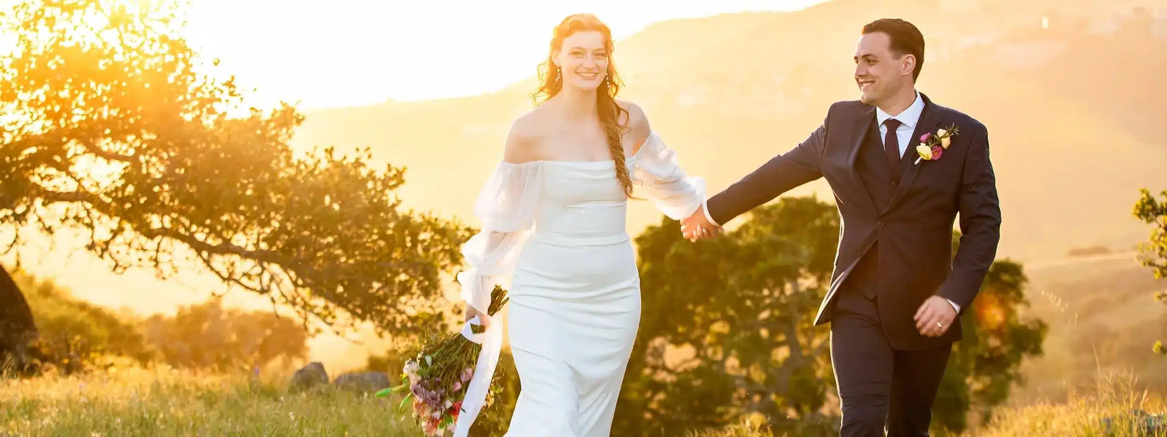 Dynamic outdoor wedding portrait with expert sun backlighting.